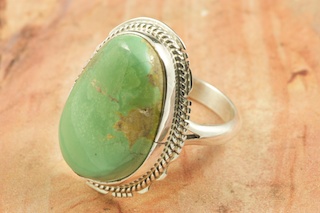 Genuine Manassa Turquoise set in Sterling Silver Ring. This Turquoise is also referred to as King�s Manassa Turquoise. The Manassa Turquoise mine is located in Manassa, Conejos County, Colorado. Created by Navajo Artist Larson Lee. Signed.